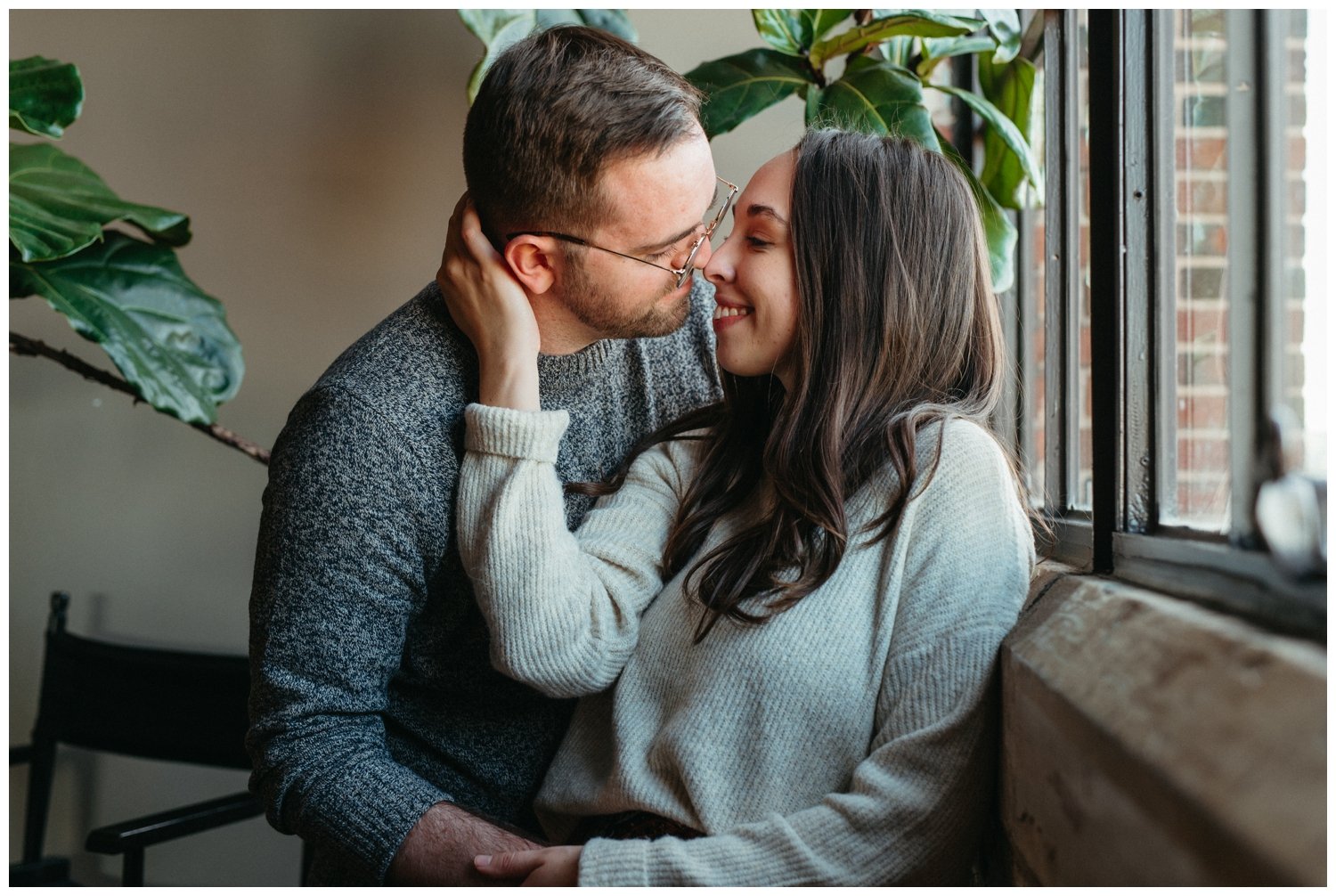 Couple kisses inside during Atlanta engagement photos