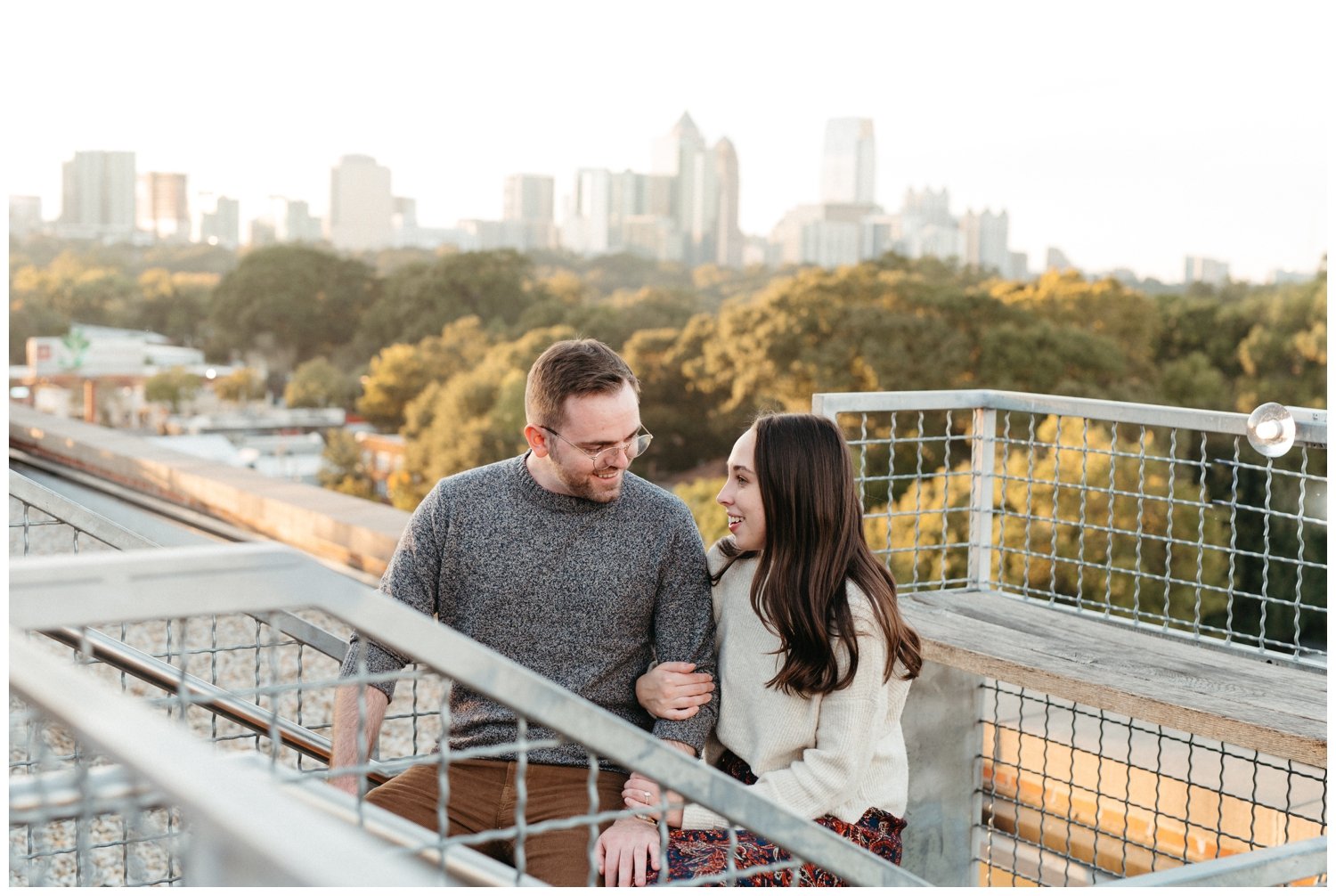 Couple explores the Roof at Ponce City Market during Atlanta engagement photos
