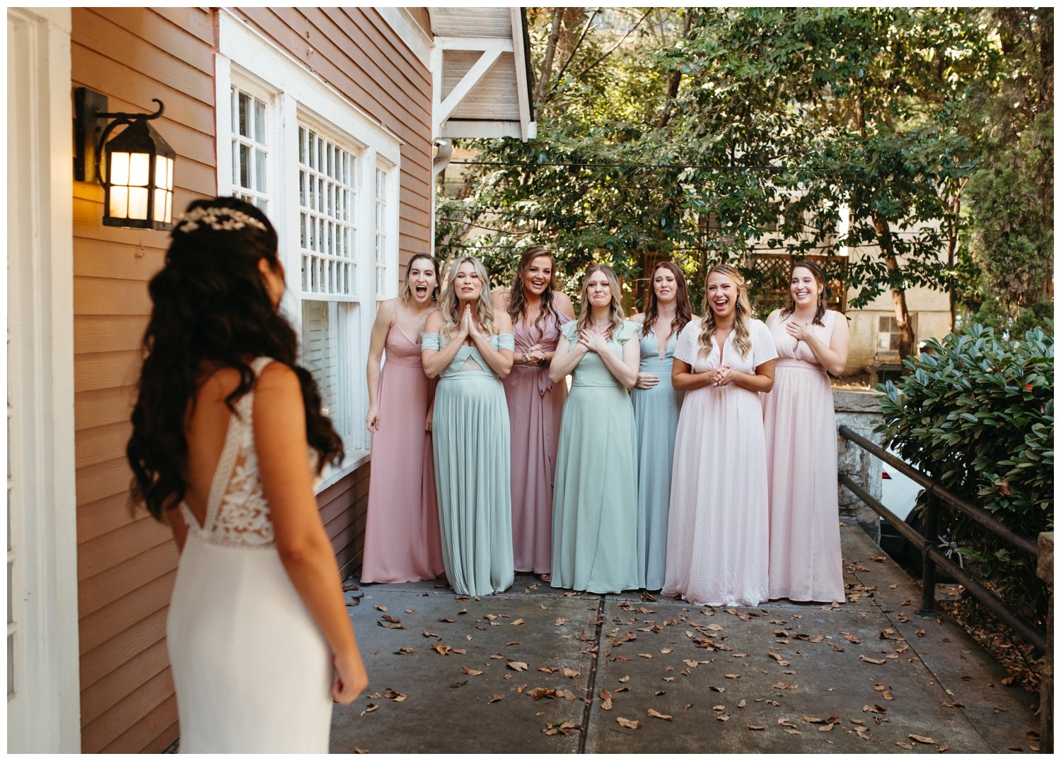 The bride shows the bridesmaids her dress for the Ponce City Market wedding