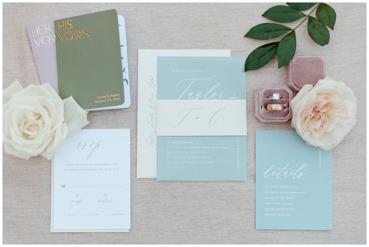 Detail photo of the invitation suite and rings for a Ponce City Market wedding