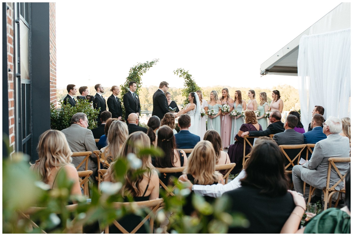 A view of the wedding ceremony at the Roof at Ponce City Market