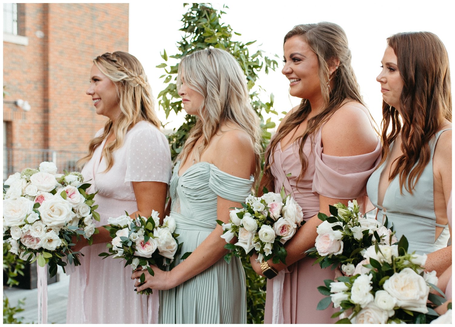 The bridesmaids watch the Ponce City Market wedding ceremony and cry happily