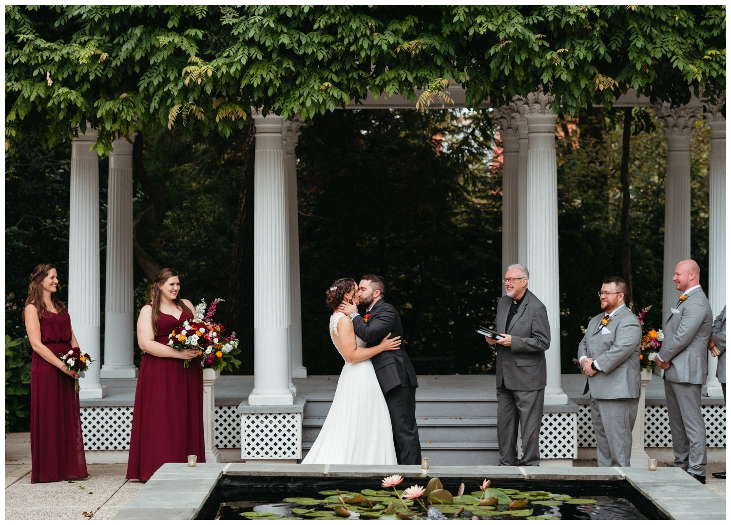 An intimate destination wedding ceremony in front of a reflecting pool