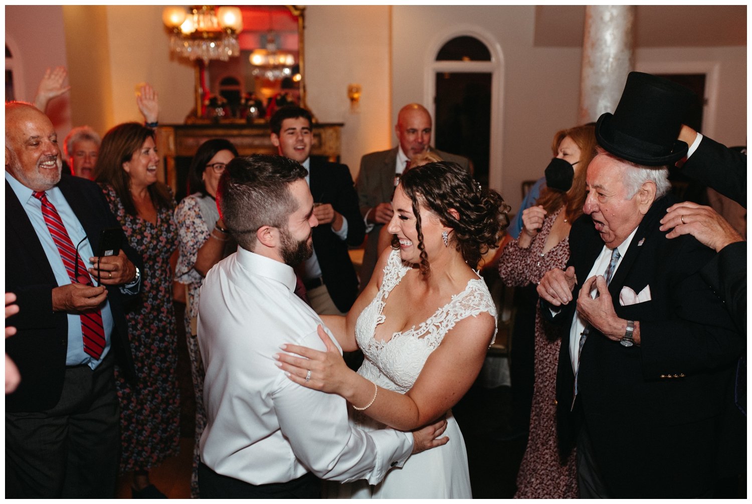 Guests join the couple on the dance floor at the intimate destination wedding