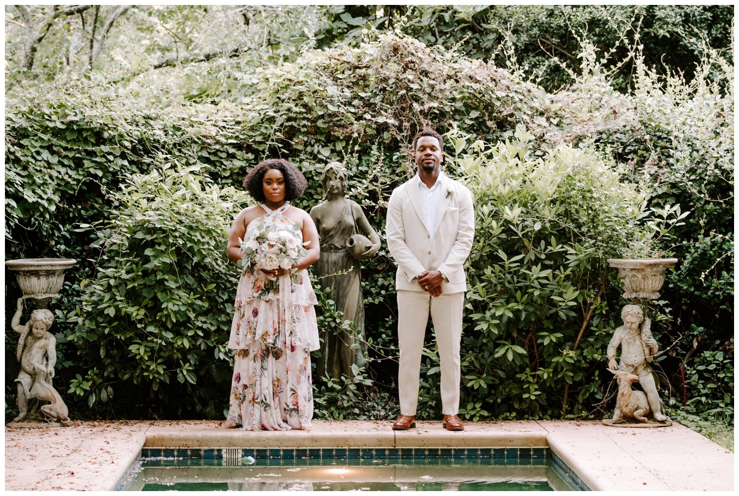 A couple poses in a garden at a luxury wedding venue in Atlanta