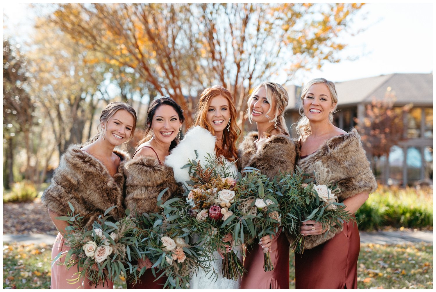 The bride and bridesmaids hold their bouquets