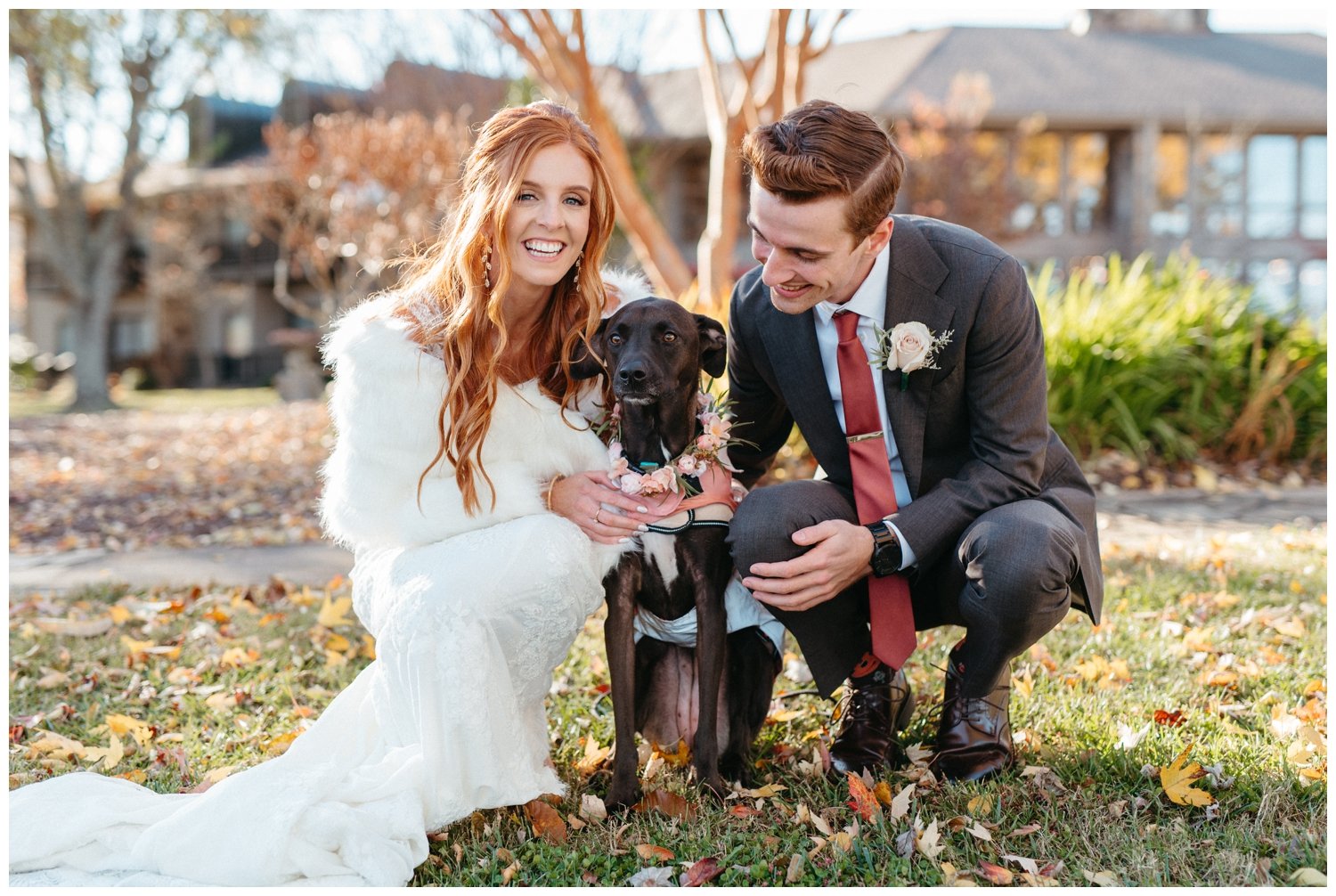 The couple poses with their dog at the mountain wedding venue