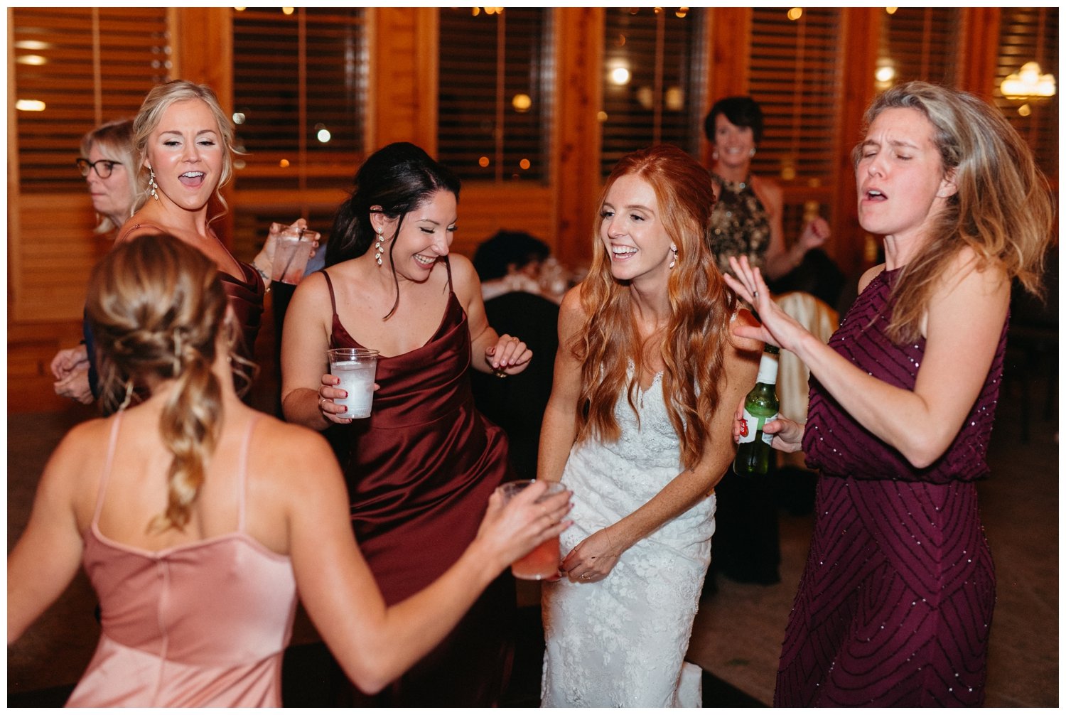 The bride dances with friends